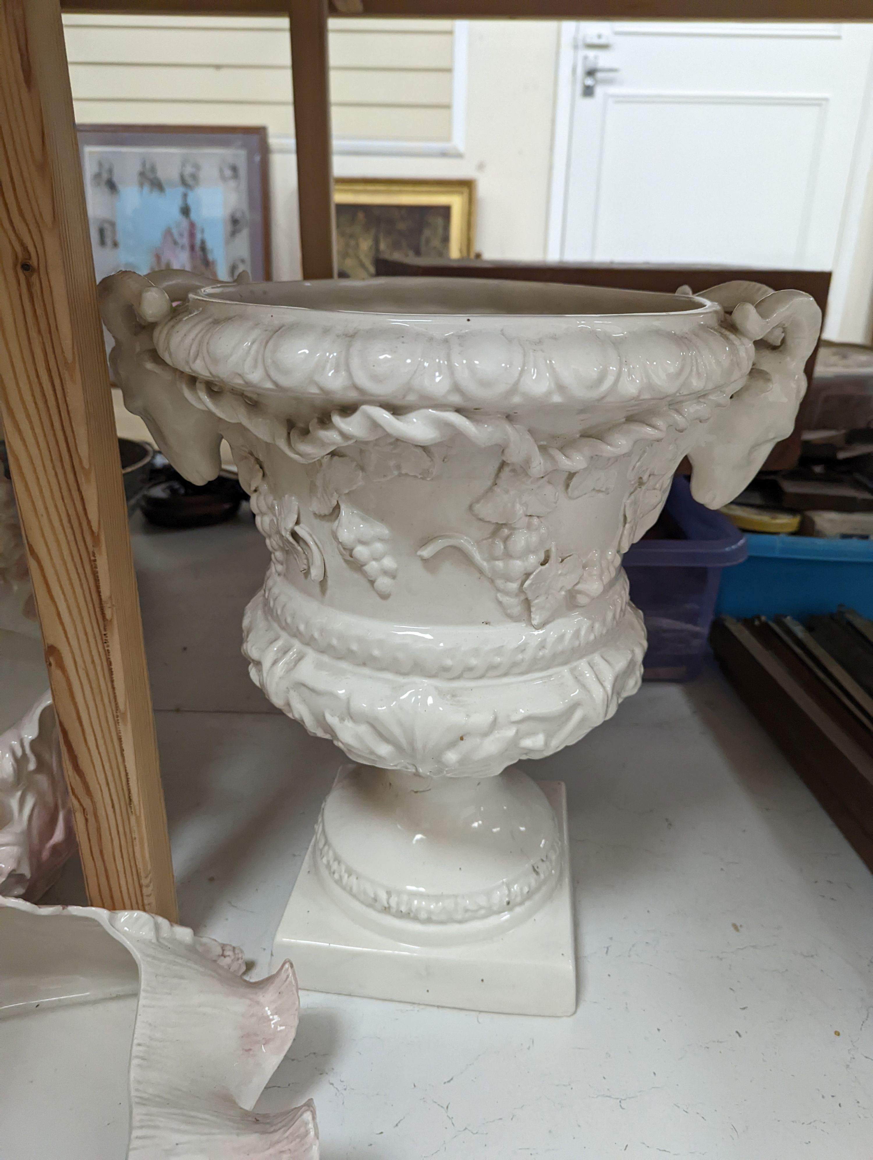 Decorative modern continental pottery, including two jardinières, modelled with swans, a white glazed urn
